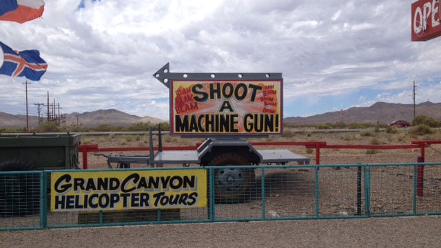 A sign at the Last Stop in White Hills, AZ, directs visitors to shooting range. A shooting instructor was shot there on Aug. 25, 2014, according to the Mohave Co. Sheriff's Office. (Tiffany Murphy/FOX5)