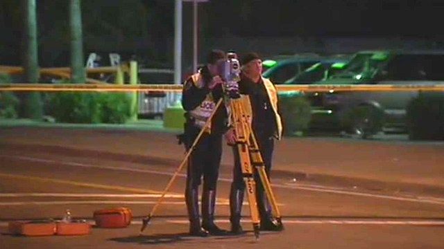 Chandler police officers investigate the scene where a boy was struck ...